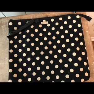 Polka dot fabric pouch with lining.